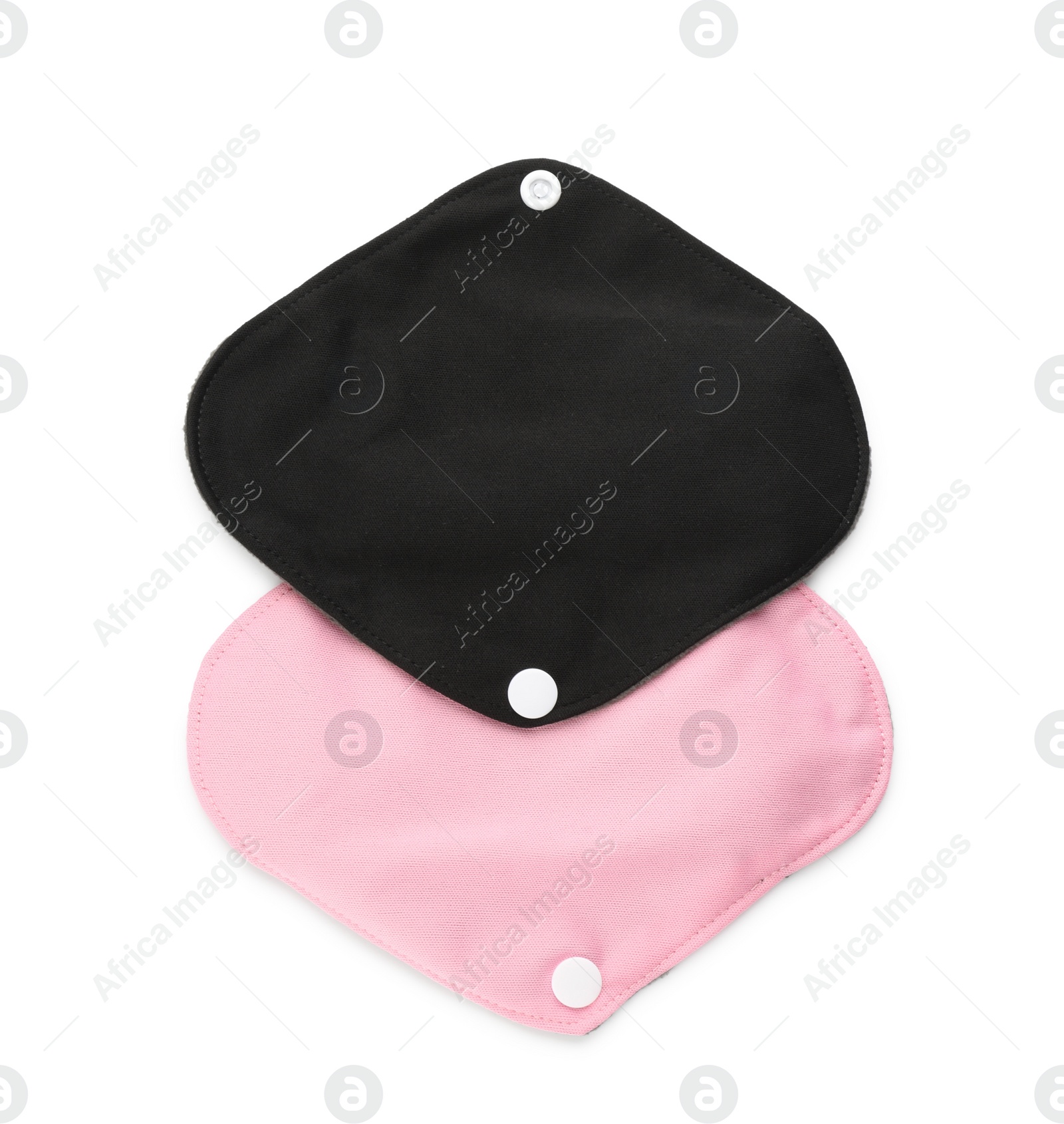 Photo of Cloth menstrual pads on white background, top view. Reusable female hygiene product