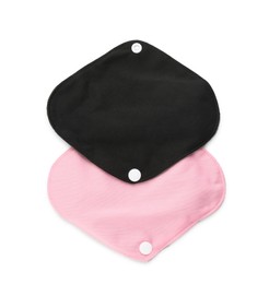 Photo of Cloth menstrual pads on white background, top view. Reusable female hygiene product