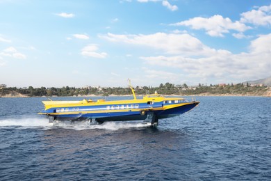 Photo of Modern passenger hydrofoil boat in sea on sunny day