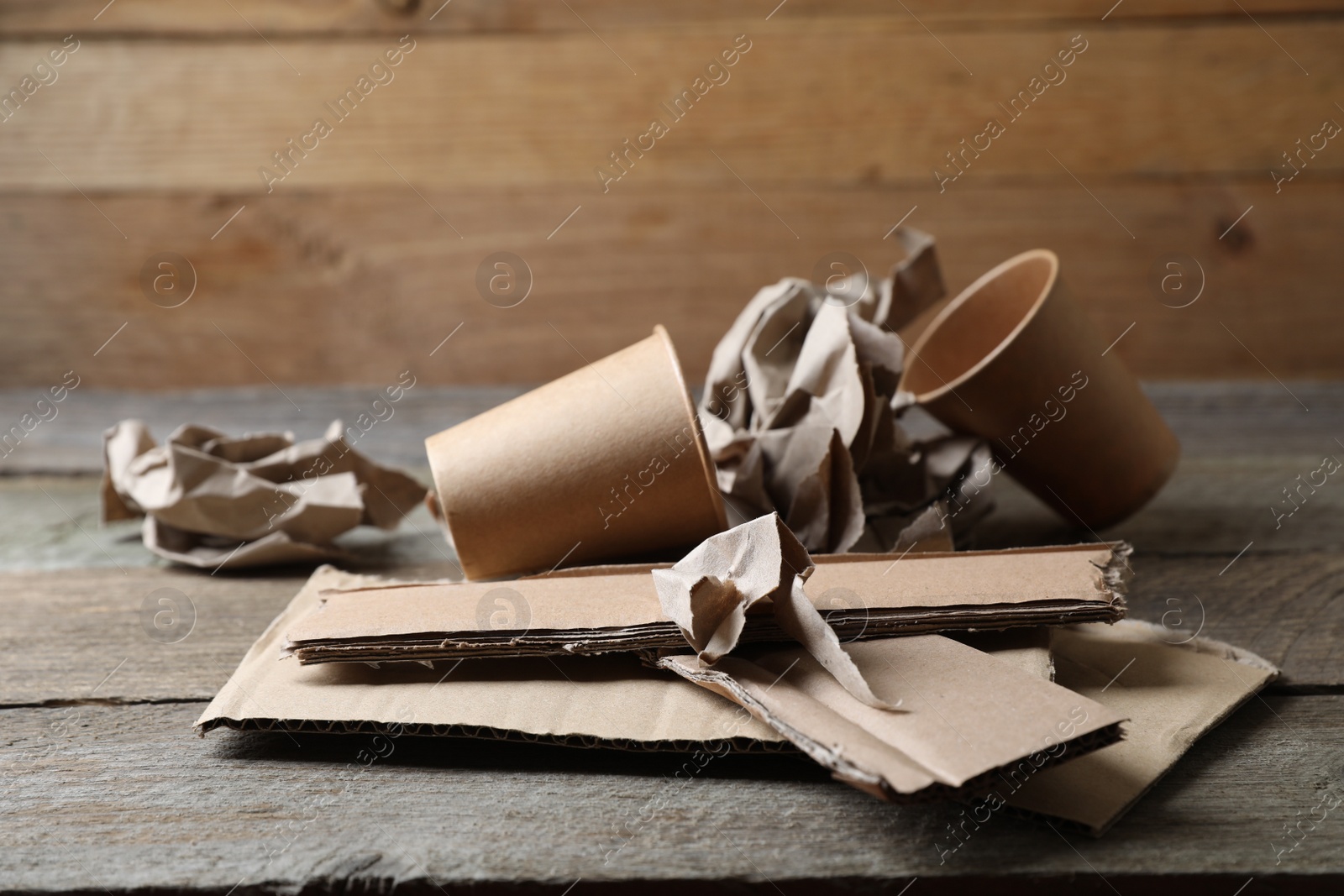 Photo of Stack of waste paper on wooden table