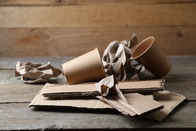 Stack of waste paper on wooden table