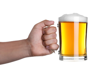 Man holding glass mug with beer on white background, closeup