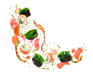 Different sushi rolls and ingredients on white background