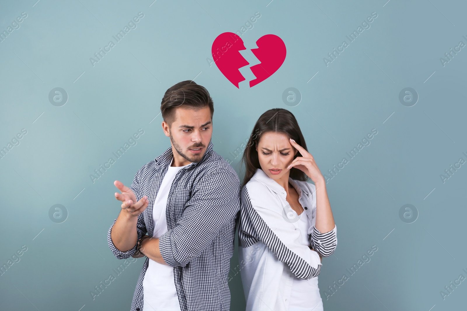 Image of Upset young couple and illustration of broken heart on color background. Relationship problems