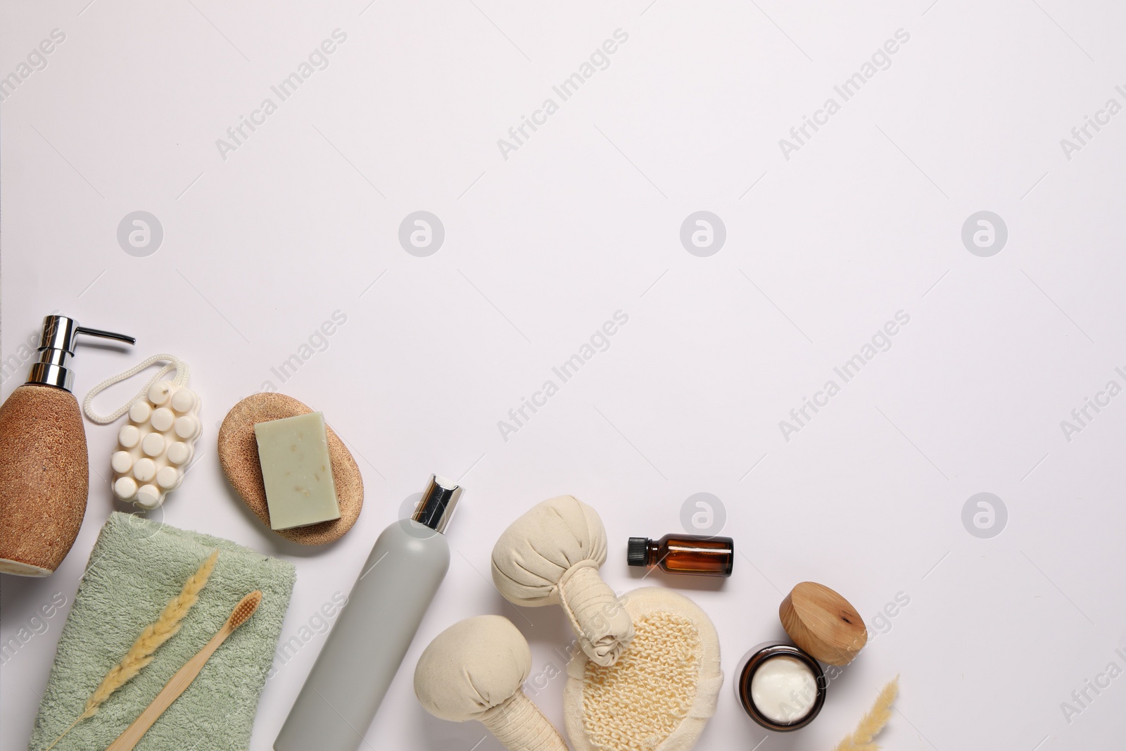 Photo of Bath accessories. Different personal care products and dry spikelets on white background, flat lay with space for text