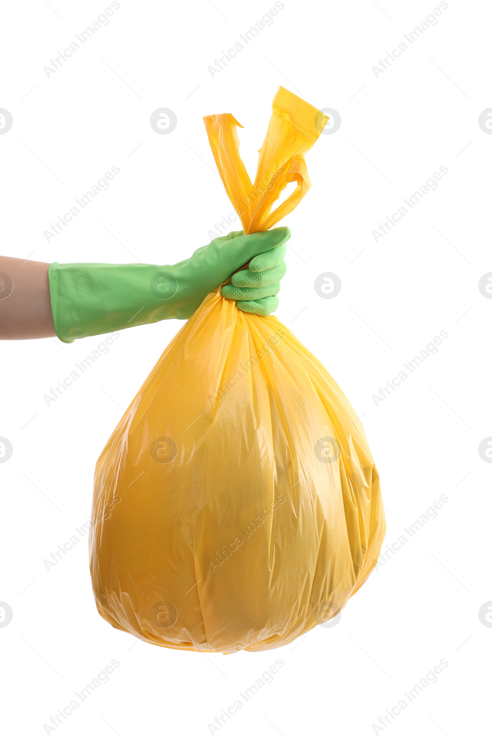 Photo of Woman holding plastic bag full of garbage on white background, closeup