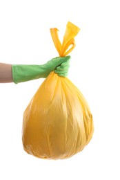 Photo of Woman holding plastic bag full of garbage on white background, closeup