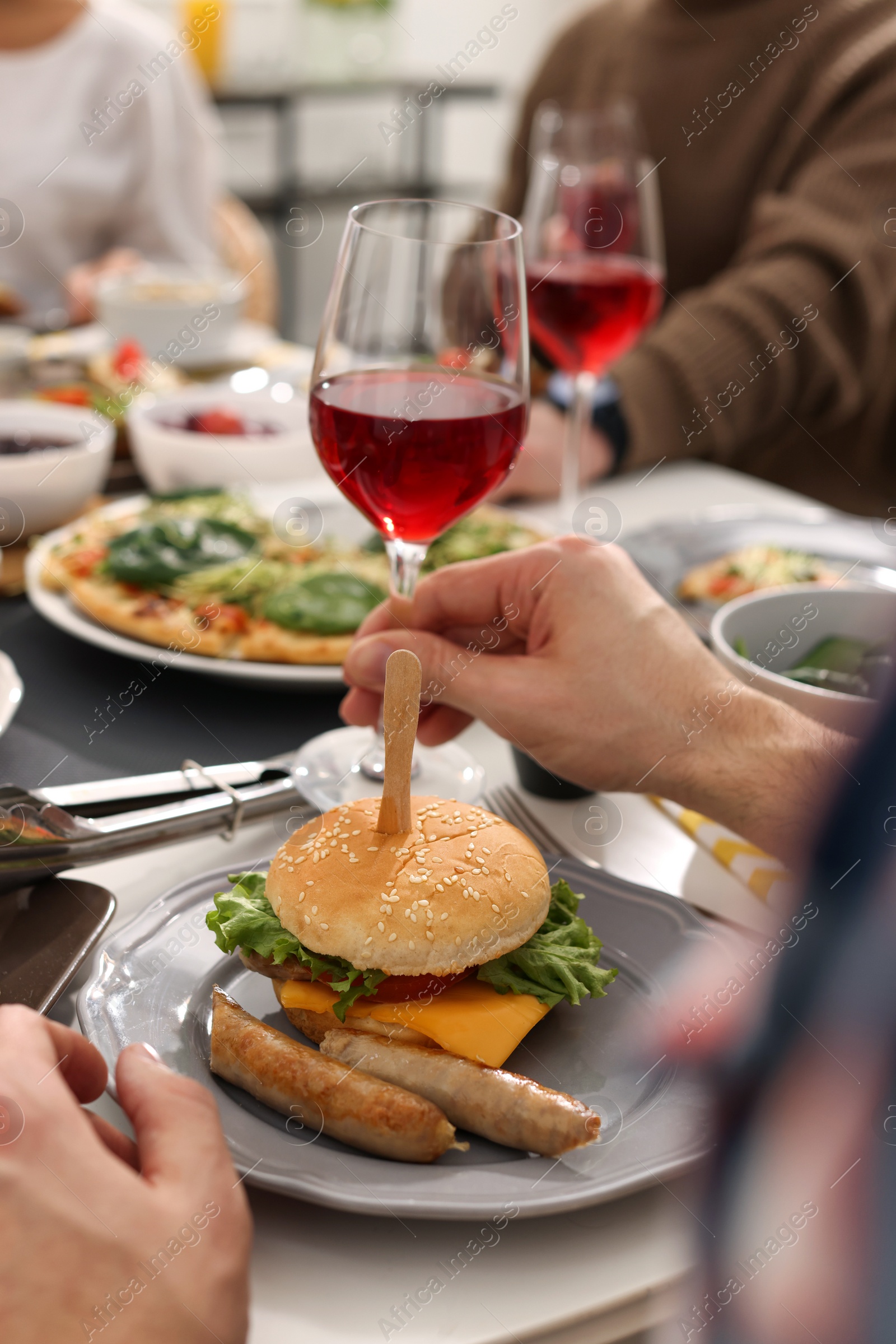 Photo of People having brunch together at table indoors, closeup