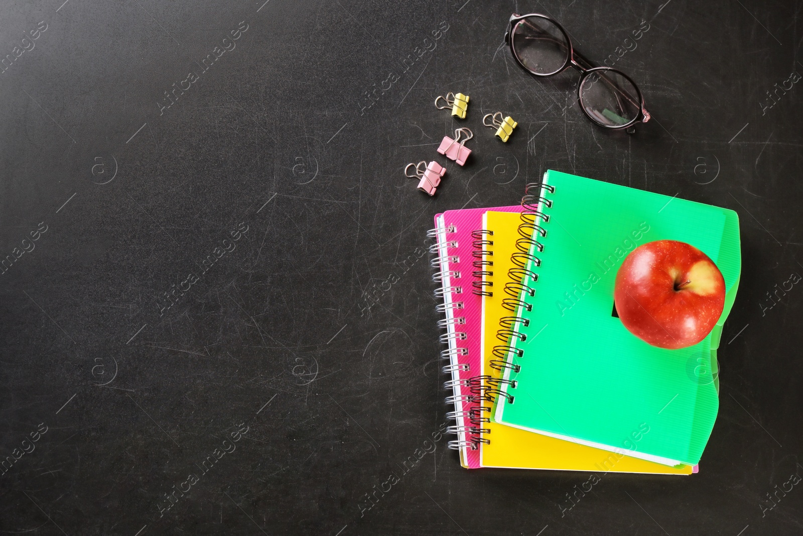 Photo of Flat lay composition for Teacher's day on chalkboard