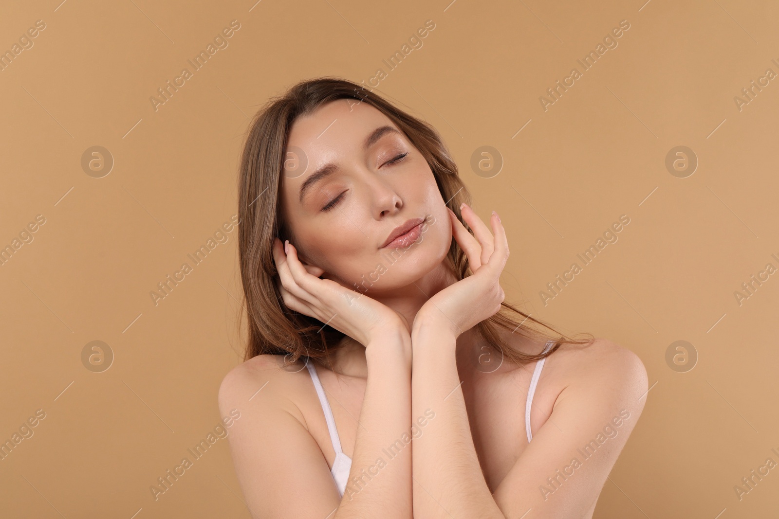 Photo of Beautiful woman with healthy skin on beige background