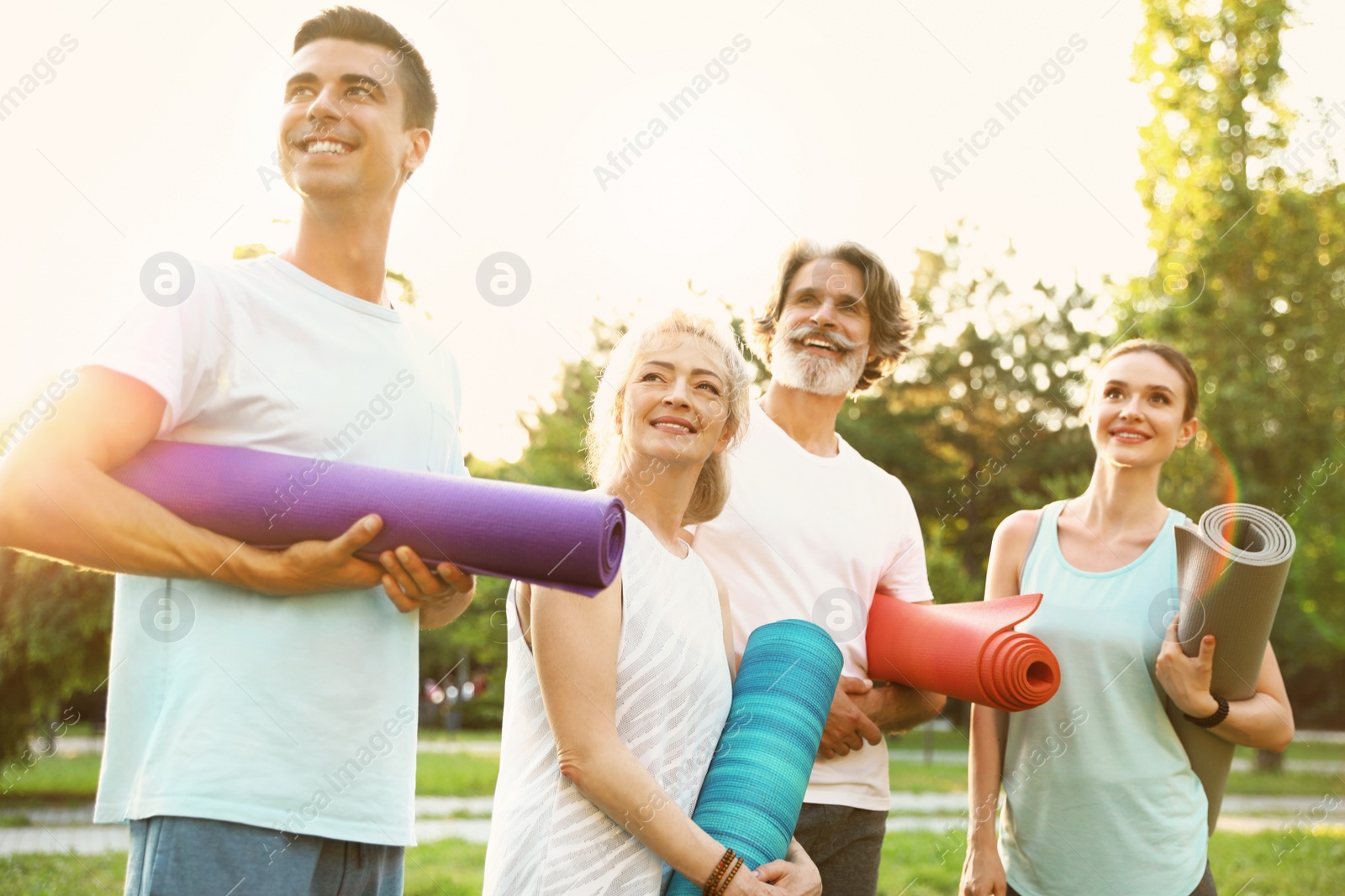 Photo of Group of people before morning yoga practice in park