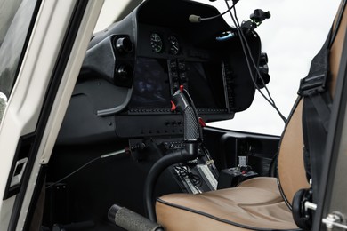 Helicopter cockpit with new modern functional panel and leather seat