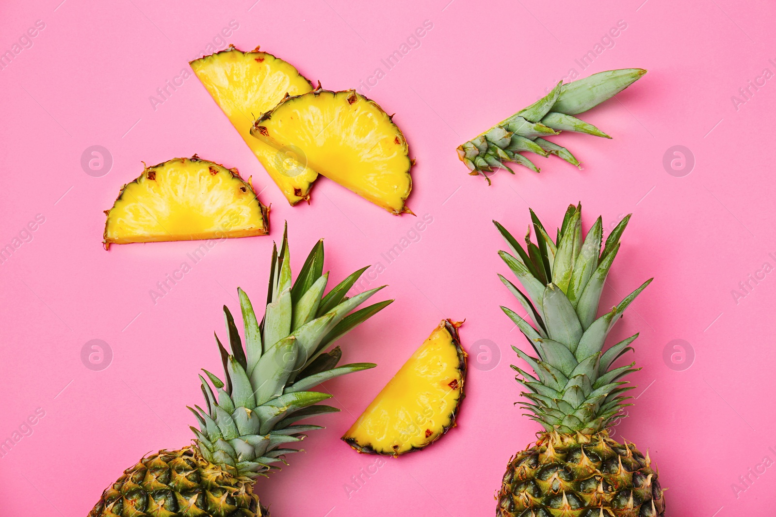 Photo of Fresh pineapples on color background, flat lay