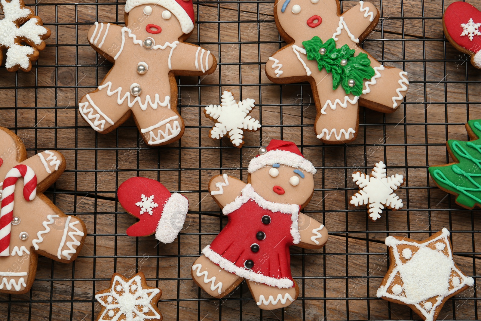Photo of Delicious Christmas cookies on wooden table, top view