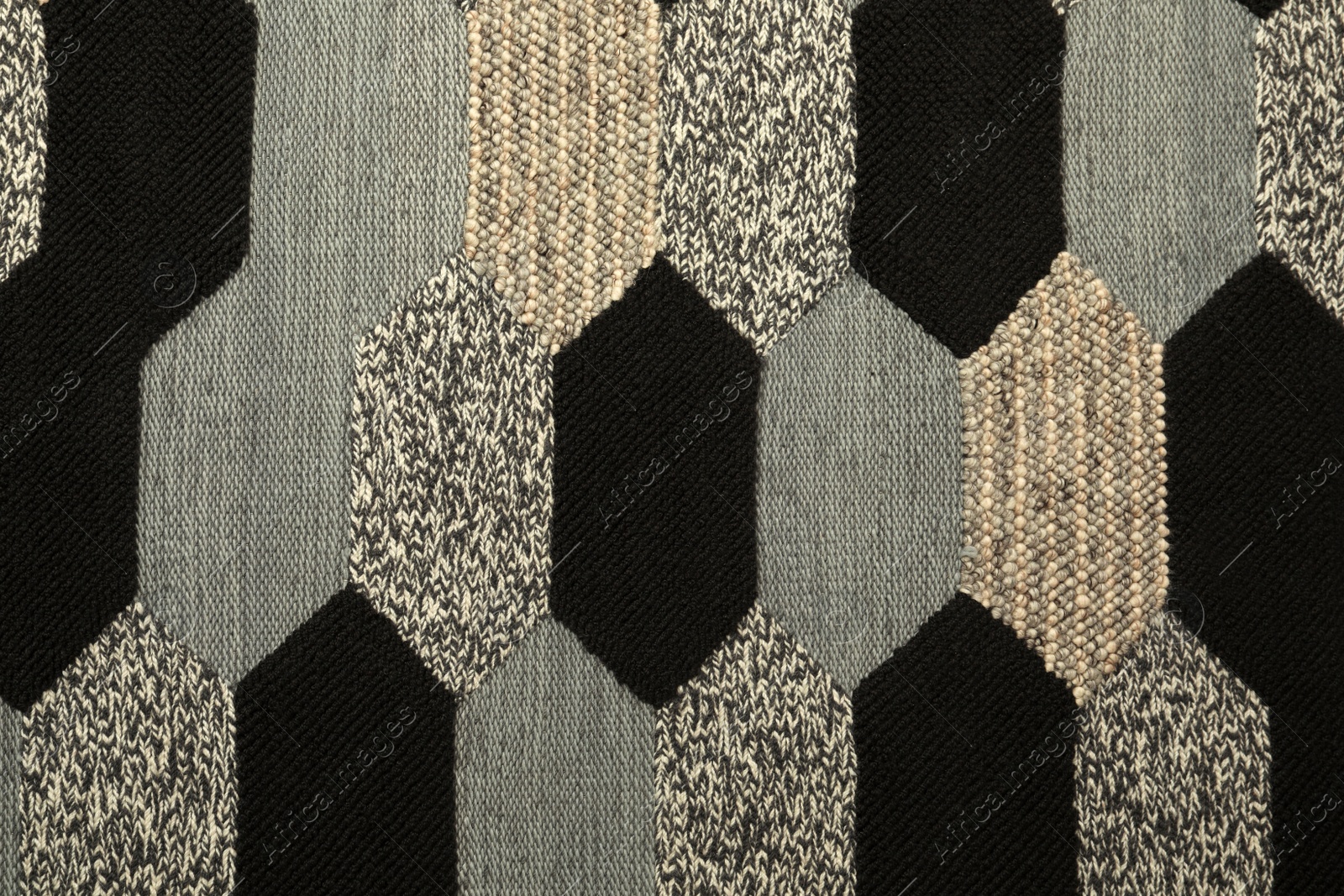 Photo of Carpet with geometric pattern as background, closeup