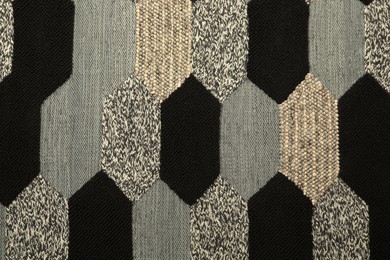 Photo of Carpet with geometric pattern as background, closeup