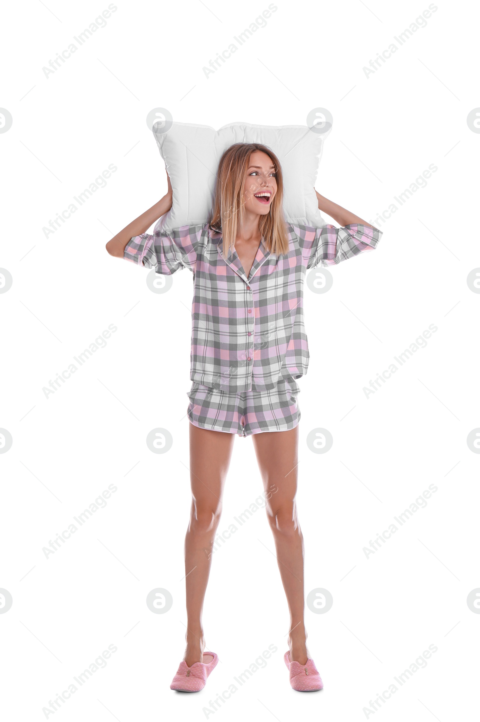 Photo of Happy woman in pajamas with pillow on white background