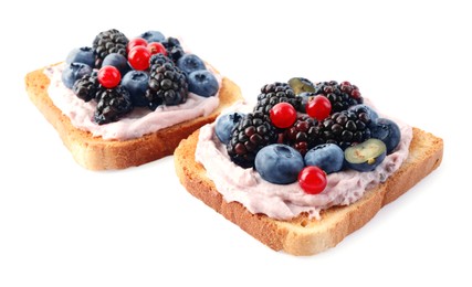 Tasty sandwiches with cream cheese and berries isolated on white