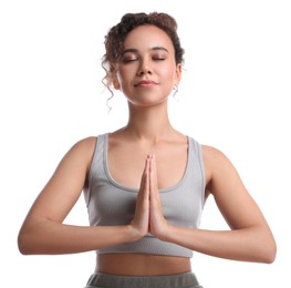 Photo of Beautiful African-American woman meditating on white background