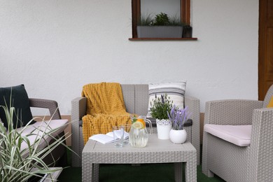 Comfortable furniture with beautiful decor on outdoor terrace