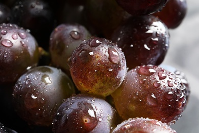 Photo of Bunch of fresh ripe juicy grapes as background, closeup