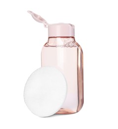 Photo of Bottle of micellar cleansing water and cotton pad isolated on white