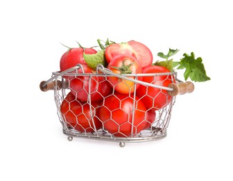 Photo of Many ripe tomatoes with leaves in metal basket on white background