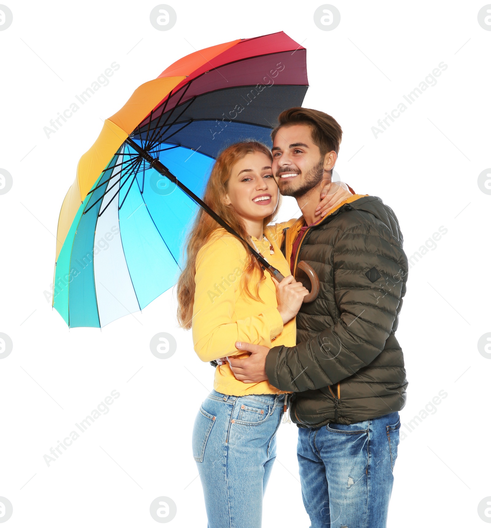 Photo of Young romantic couple with bright umbrella on white background