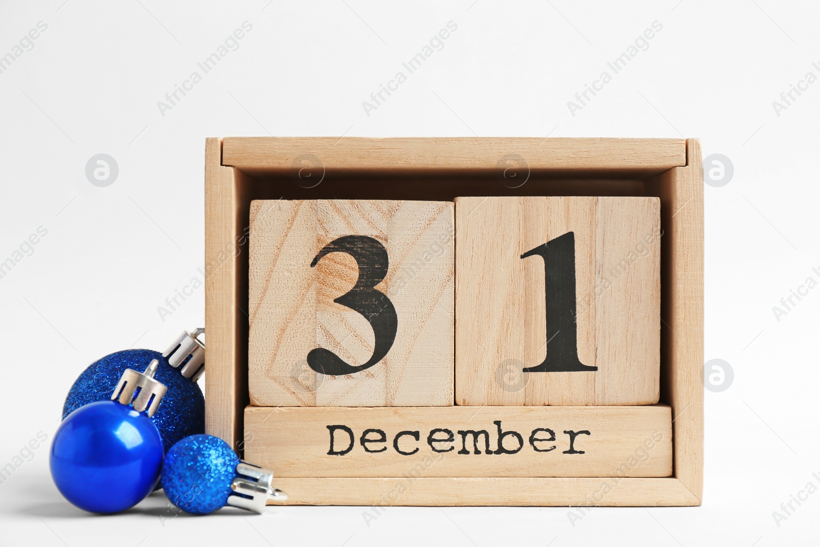 Photo of Wooden block calendar and decor on white background. Christmas countdown