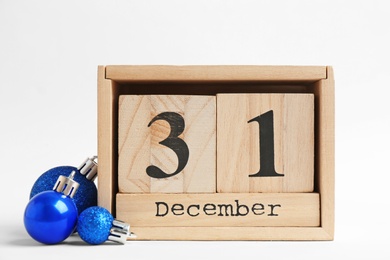 Photo of Wooden block calendar and decor on white background. Christmas countdown