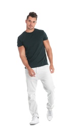 Photo of Young man in stylish jeans on white background