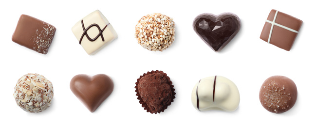 Image of Set with different chocolate candies on white background, top view. Banner design