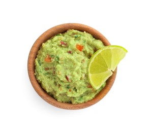 Photo of Bowl of delicious guacamole with lime isolated on white, top view