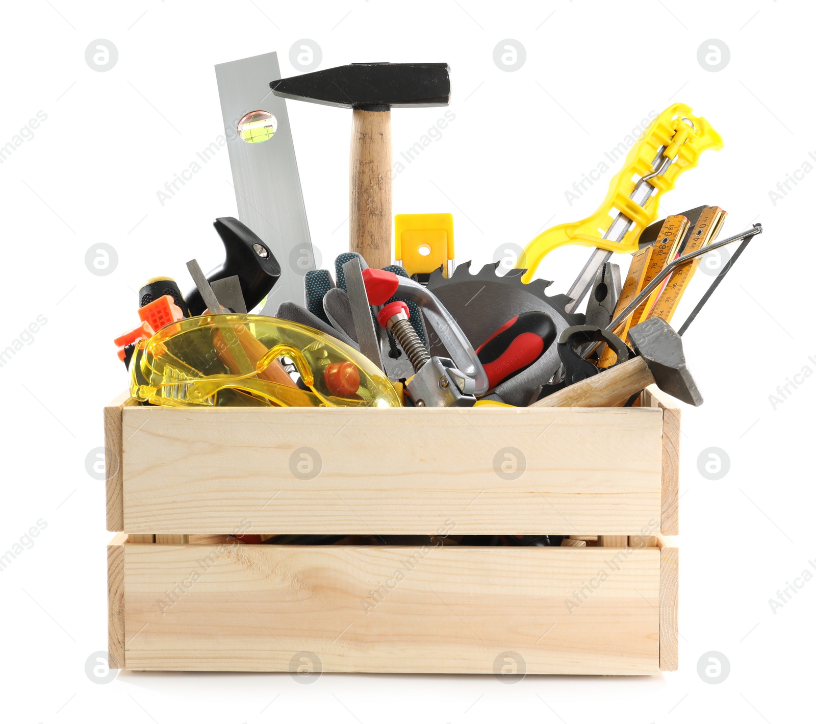 Photo of Wooden crate with different carpenter's tools isolated on white