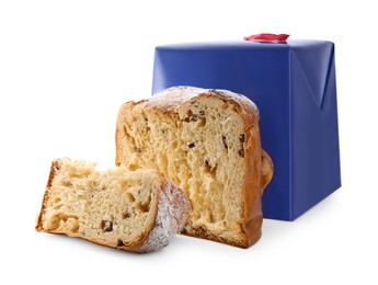 Delicious cut Panettone cake with powdered sugar and box on white background. Traditional Italian pastry
