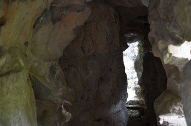 View through narrow gap between rocks outdoors