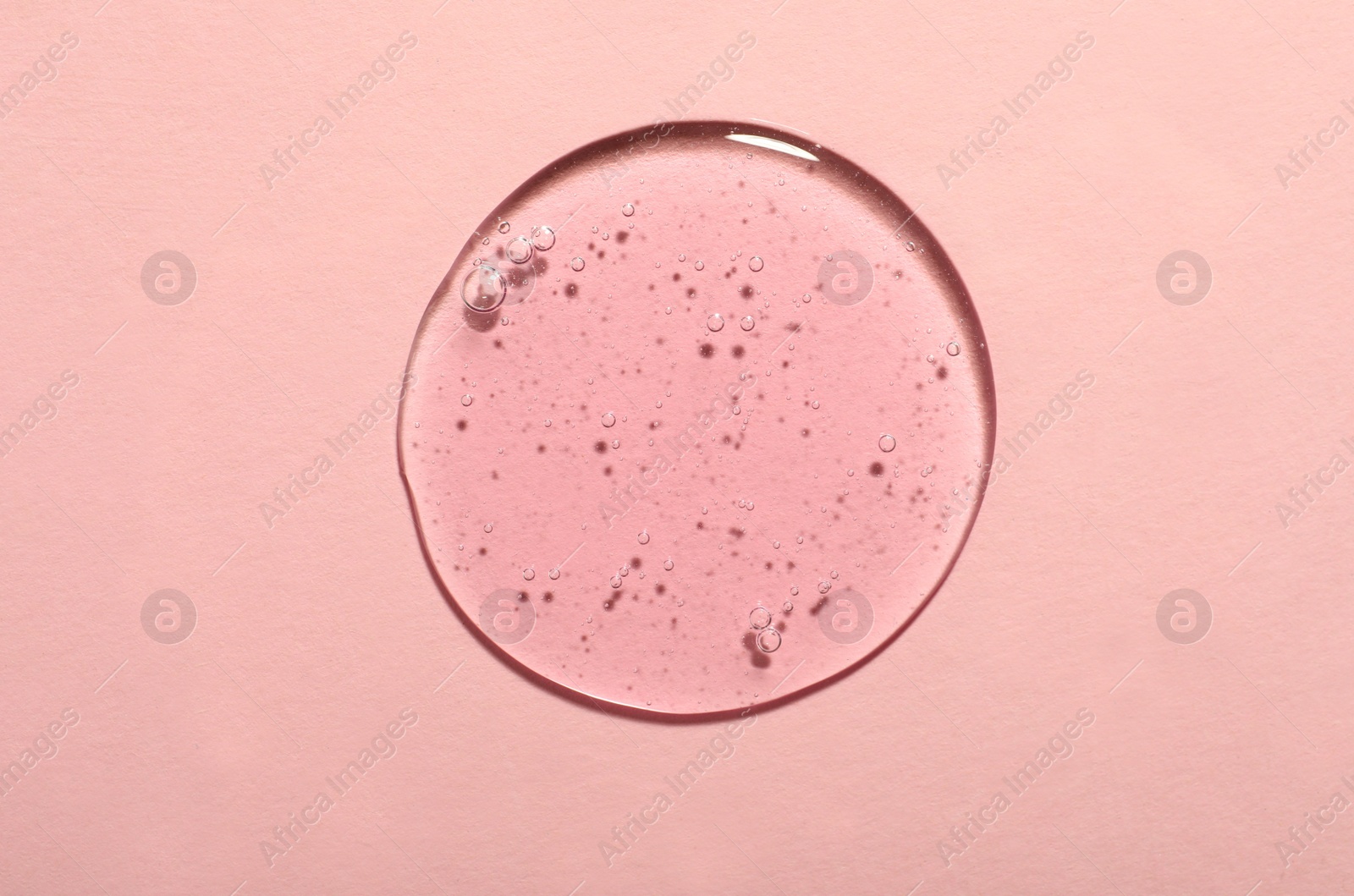Photo of Sample of cosmetic gel on pink background, top view