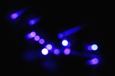 Photo of Beautiful colorful lights on dark background. Bokeh effect