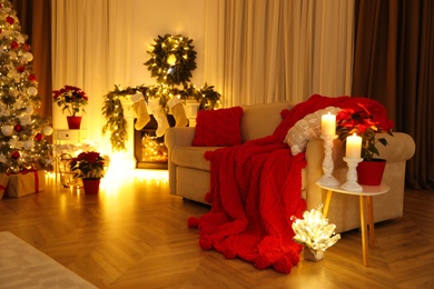 Photo of Christmas themed photo zone. Cozy living room interior imitation