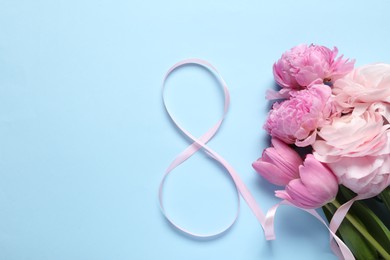 Photo of 8th of March greeting card design with pink ribbon, beautiful flowers and space for text on light blue background, flat lay. International Women's day