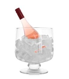 Bottle of rose champagne in vase with ice on white background