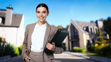 Image of Smiling real estate agent with portfolio outdoors, space for text. Beautiful houses on street