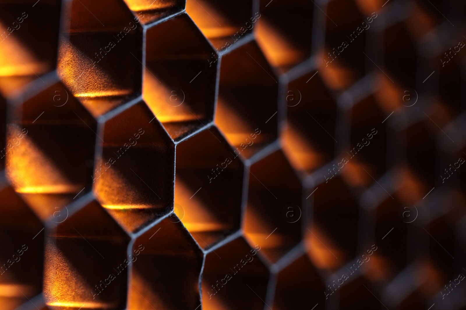 Photo of Texture of honeycomb grid for reflector as background, macro view