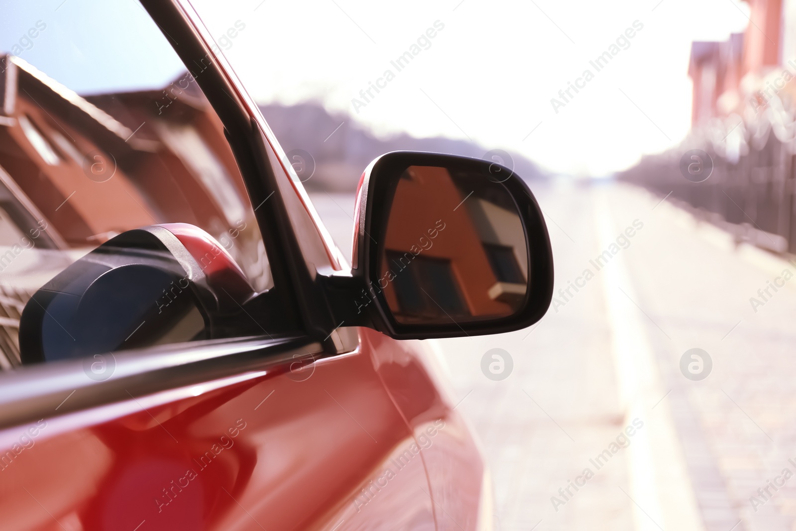 Photo of Side rear view mirror of modern car outdoors