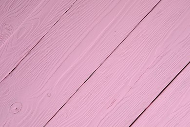 Photo of Texture of pink wooden surface as background, closeup