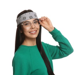 Photo of Young woman wearing stylish bandana on white background