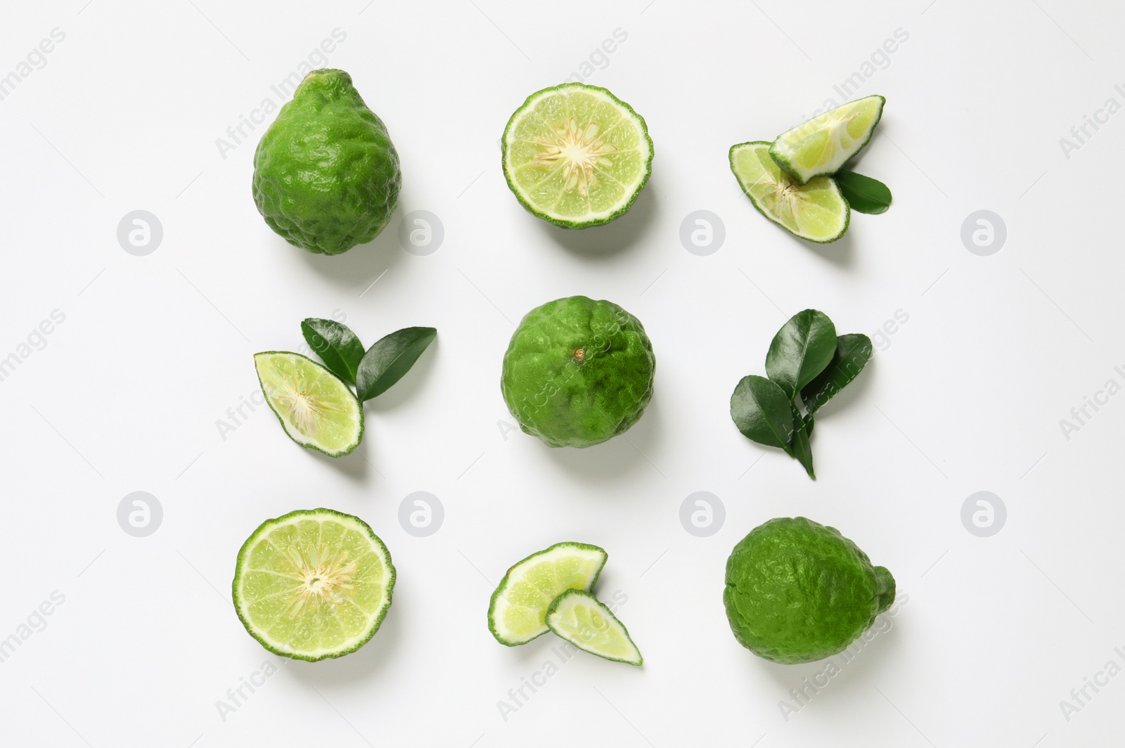 Photo of Flat lay composition with ripe bergamot fruits on white background