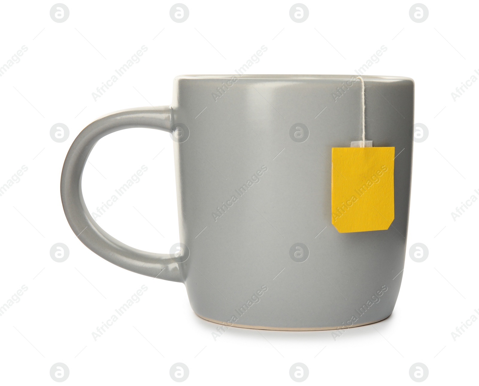 Photo of Ceramic cup of hot aromatic tea on white background