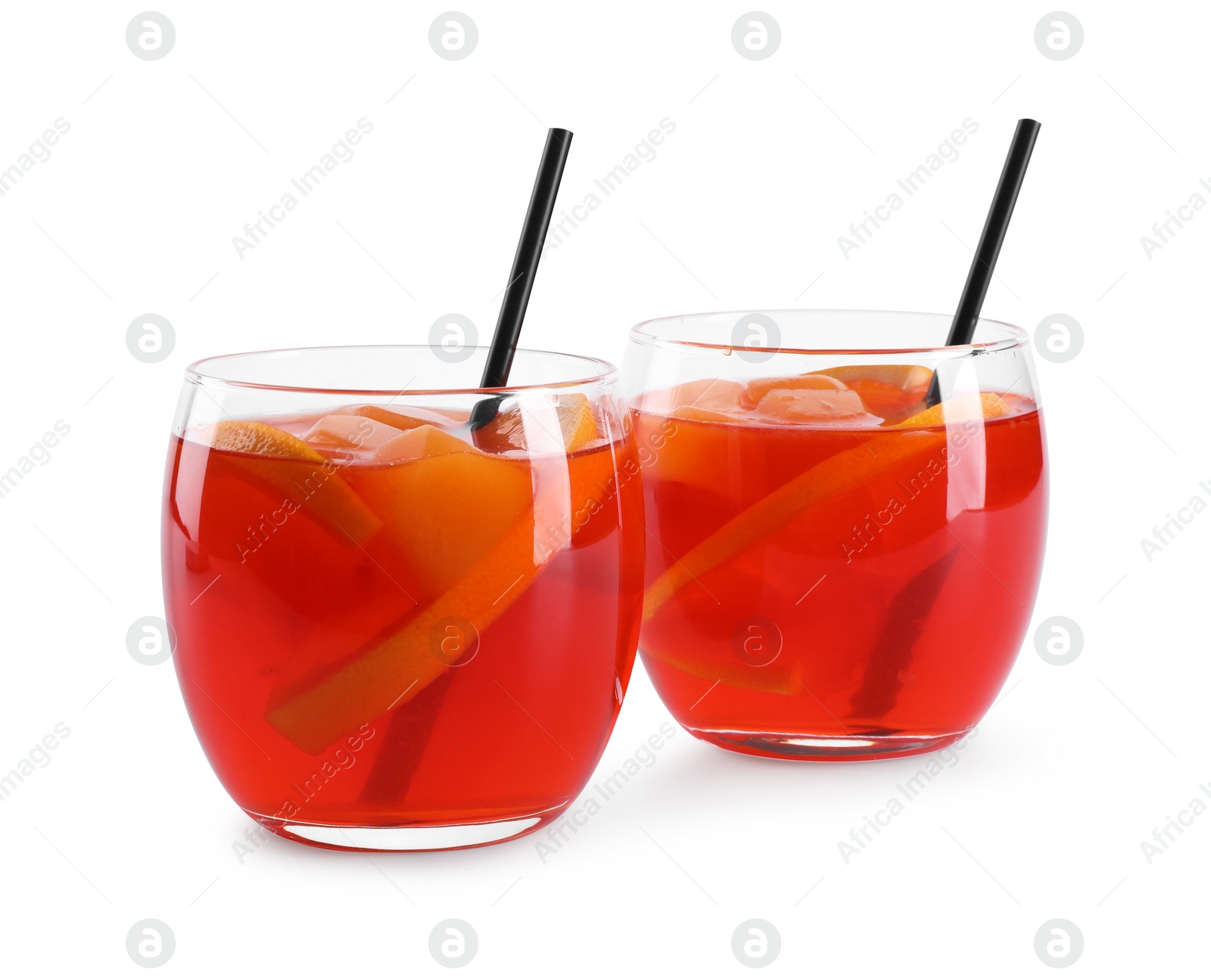 Photo of Aperol spritz cocktail, straws and orange slices in glasses isolated on white