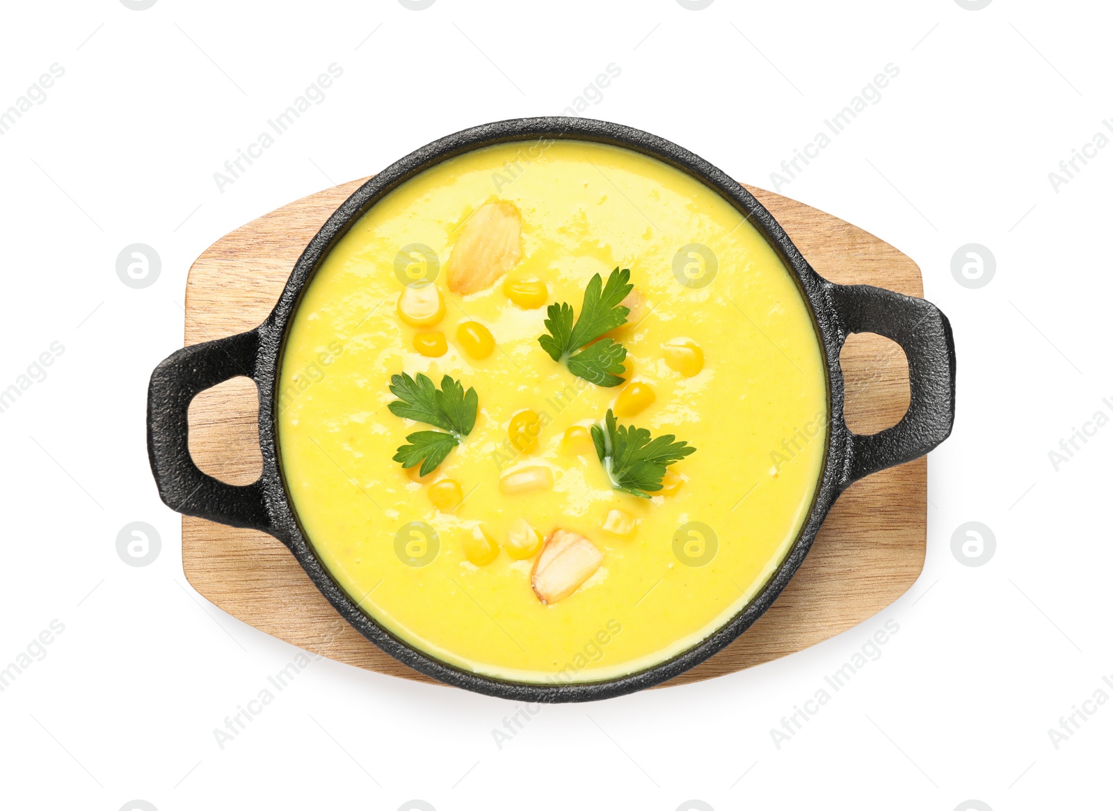 Photo of Delicious creamy corn soup isolated on white, top view